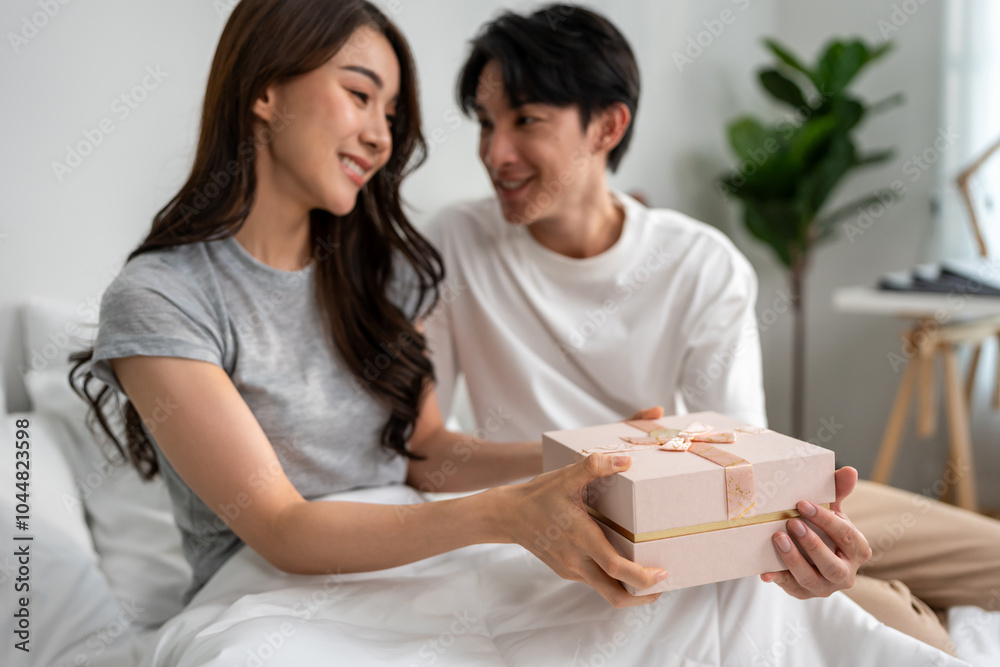 Asian beautiful woman receive birthday present gift box from boyfriend. Asian beautiful woman receive birthday present gift box from boyfriend.