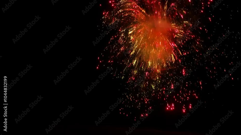 orange and red fireworks in the night sky