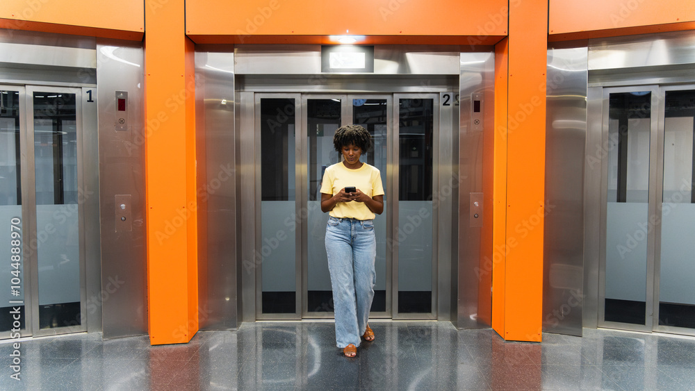 Young woman using mobile phone at subway station Young woman using mobile phone at subway station