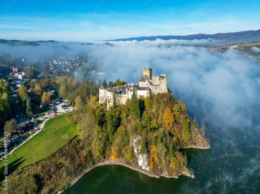 Medieval Castle in Niedzica, Poland, in fall with fog. Aerial view