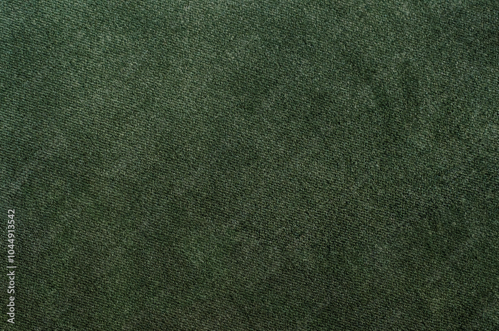 Fototapeta premium High-quality green velour texture showcasing soft fabric surface with fine details.