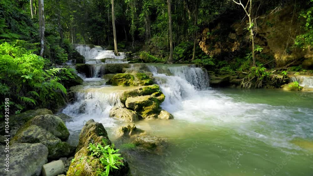 Huai Mae Khamin Waterfall is located in Kanchanaburi Province, Thailand. It is a beautiful waterfall with cool and refreshing water temperatures. It is located in a lush forest with large green trees. Huai Mae Khamin Waterfall is located in Kanchanaburi Province, Thailand. It is a beautiful waterfall with cool and refreshing water temperatures. It is located in a lush forest with large green trees.