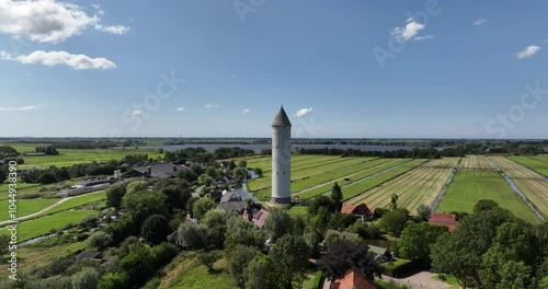 Aerial footage of the water tower in De Meije village against blue sky in Nieuwkoop, Netherlands. photo