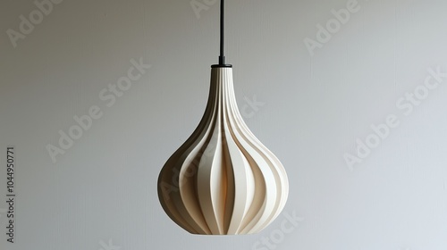 A contemporary pendant light featuring a sleek shape, beautifully hanging against a white background, perfect for showcasing modern interior design elements.