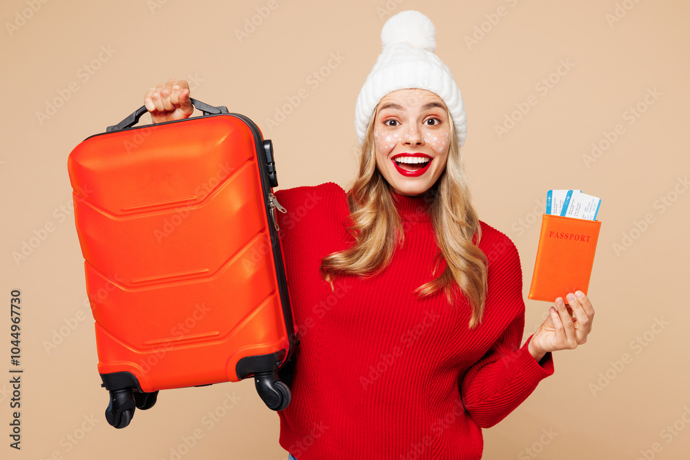 Traveler woman wear sweater hat hold passport ticket bag isolated on plain beige background. Tourist travel abroad in free time rest getaway. Air flight trip, Happy New Year Christmas holiday concept. Traveler woman wear sweater hat hold passport ticket bag isolated on plain beige background. Tourist travel abroad in free time rest getaway. Air flight trip, Happy New Year Christmas holiday concept.