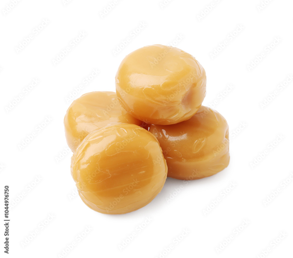 Tasty hard toffee candies isolated on white Tasty hard toffee candies isolated on white