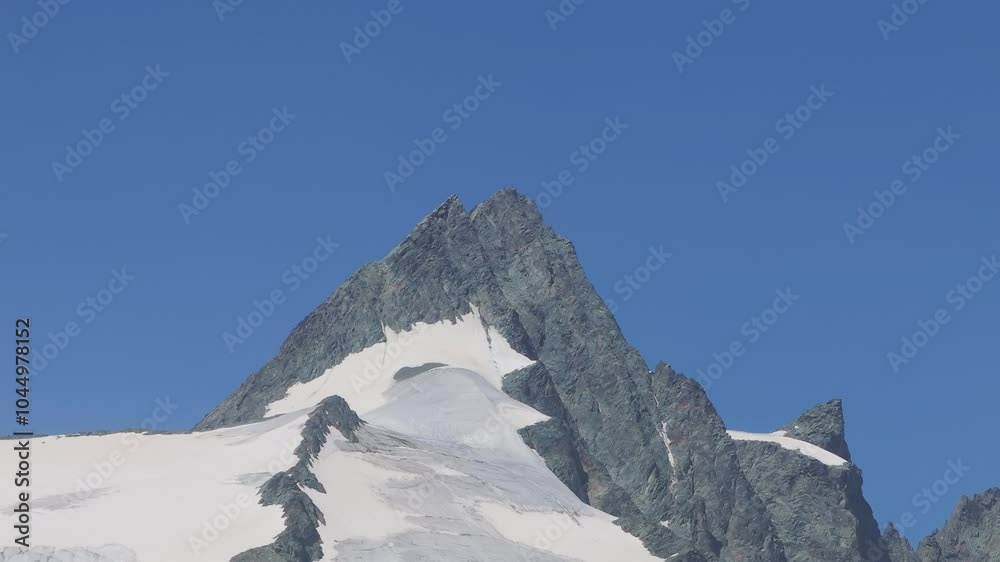 Tele camera drone captures the snow-covered Grossglockner peak in stunning detail. Tele camera drone captures the snow-covered Grossglockner peak in stunning detail.