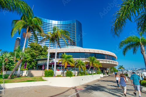 San Diego - July 30, 2017: Tourists, streets and buildings along Seaport Village and Embarcadero Park photo