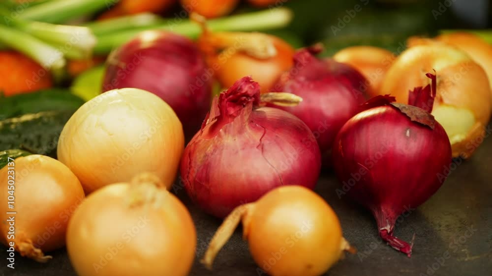 Background video of an onion rolling on the table. Ingredient spice for cooking dishes in the kitchen. High quality FullHD footage Background video of an onion rolling on the table. Ingredient spice for cooking dishes in the kitchen. High quality FullHD footage