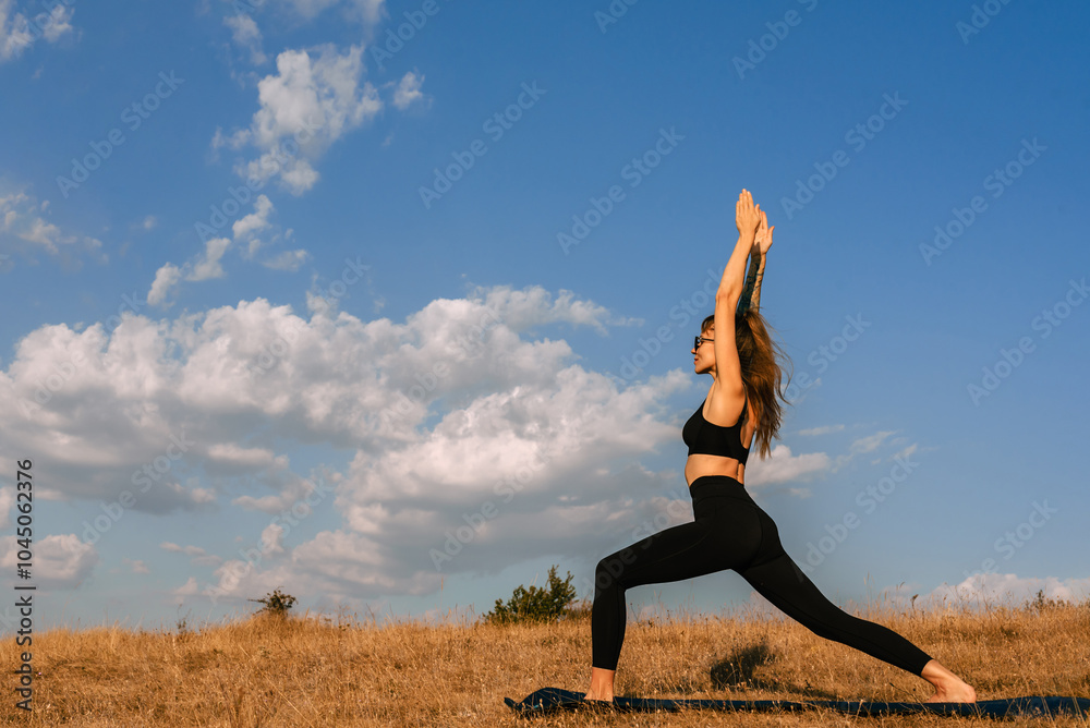 Young Woman Practicing Yoga Outdoors in Morning Young Woman Practicing Yoga Outdoors in Morning