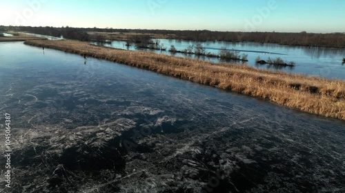 Wallpaper Mural Ice skating on a frozen lake in the Weerribben Wieden nature reserve during a cold winter day in The Netherlands. Torontodigital.ca