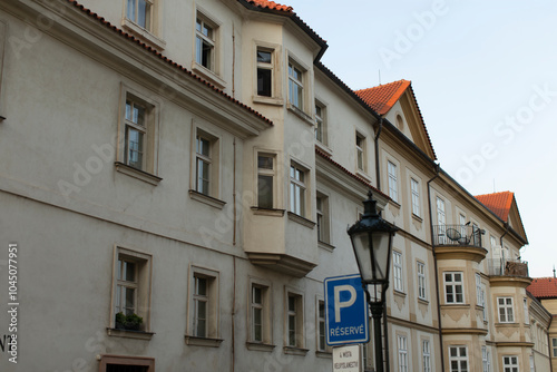 There is a prominent building featuring a blue sign that has the letter p displayed prominently on it, making it easily recognizable photo