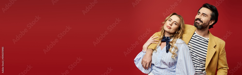 A middle aged couple exudes charm and style while enjoying a lighthearted moment together. A middle aged couple exudes charm and style while enjoying a lighthearted moment together.