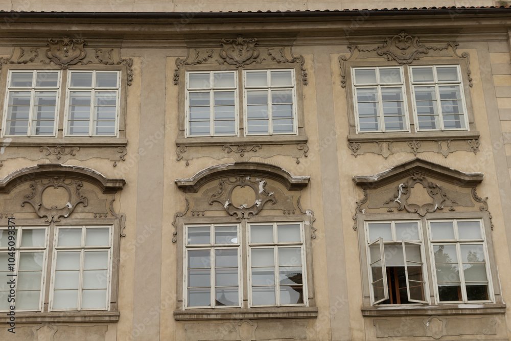 A structure or building that features a large number of windows adorning its exterior, creating an impressive visual impact A structure or building that features a large number of windows adorning its exterior, creating an impressive visual impact