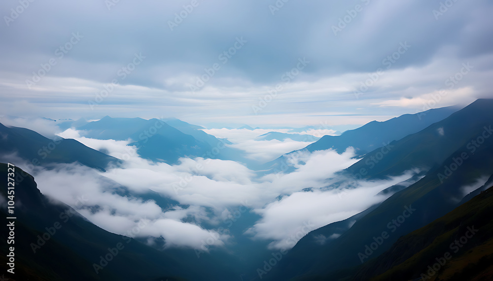 Beautiful mountains valley covered by clouds - panorama of the mountains, mountains in the morning Beautiful mountains valley covered by clouds - panorama of the mountains, mountains in the morning