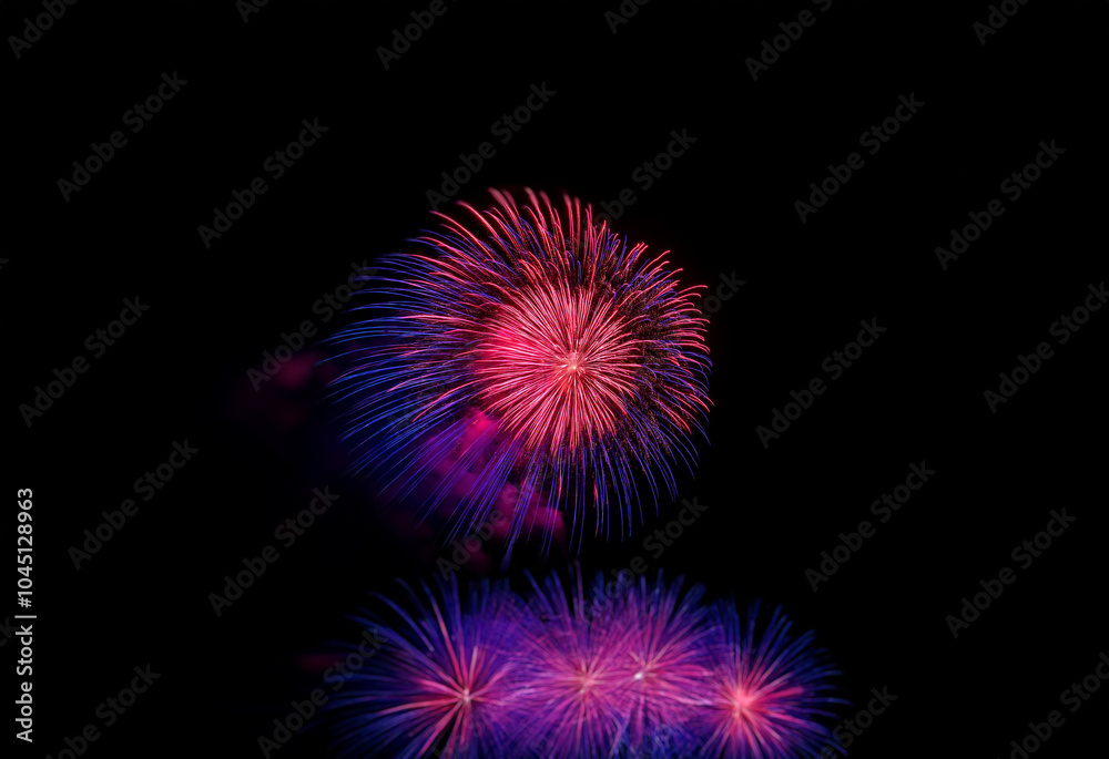 A vibrant display of fireworks bursts against a dark, isolated background. A vibrant display of fireworks bursts against a dark, isolated background.