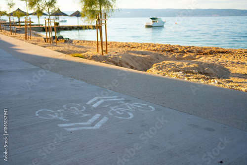 Fototapeta Naklejka Na Ścianę i Meble -  Bike path near the seashore. Active lifestyle. Podstrana, Croatia 