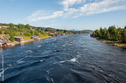 Kovda river in northern Russia, Knyazhegubskaya hydroelectric power station channel, sunny summer day