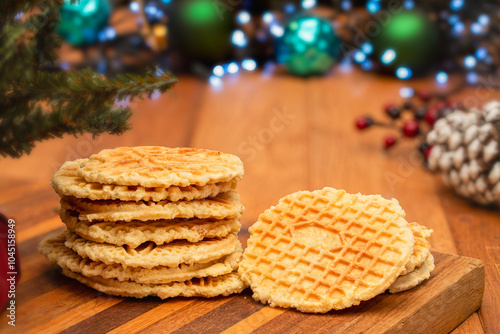 Pizzelle cookies stacked in a Christmas setting photo