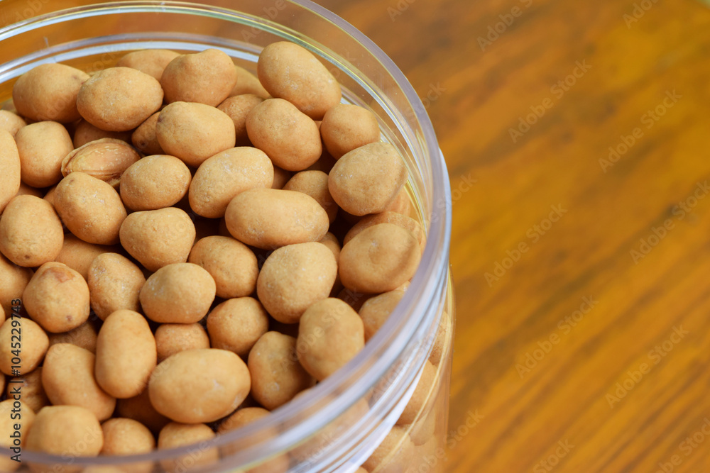 Closeup photo of Dried atomic beans in food storage or jar on wooden table Closeup photo of Dried atomic beans in food storage or jar on wooden table
