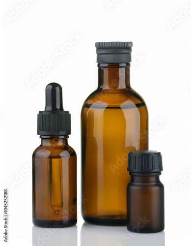 Three amber glass bottles, varying sizes, stand against a pristine white backdrop. A sophisticated and minimalist aesthetic.