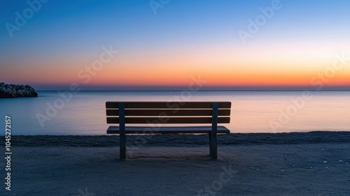 Serene beach with an empty bench, the calm waters and soft light creating a reflective, quiet moment.