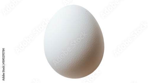 Simple white egg resting on a clean surface with natural lighting highlighting its smooth texture and form. photo