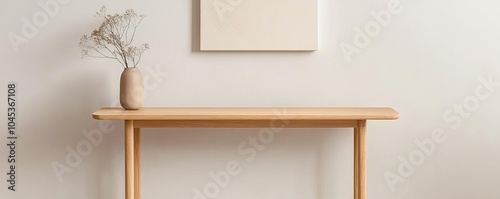 Teak wood console table in a modern entryway, sleek simplicity, abstract artwork above, soft natural lighting, clean lines and minimalistic decor, warm and neutral tones