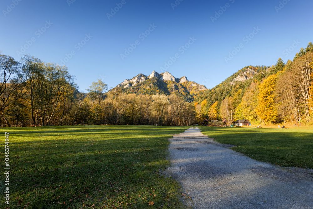 A camping site in the foreground. Beautiful Pieniny mountains. View of the Trzy Korony peak. Autumn in the mountains. Cerveny Klastor, Slovakia