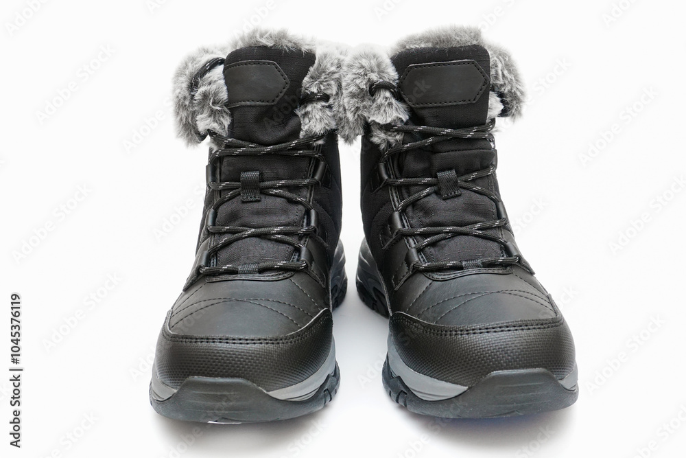 Warm winter leather waterproof ankle boots with fur inside, with laces on a white background Warm winter leather waterproof ankle boots with fur inside, with laces on a white background