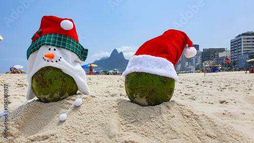 Two coconuts with Santa and Snowman hats in the Ipanema beach in Rio de Janeiro. Tropical Christmas concept