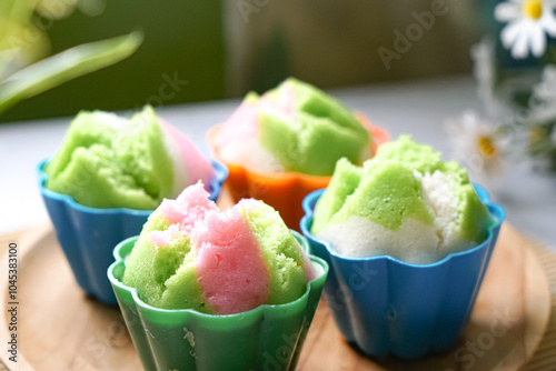 Colourful Blossom Steamed Cupcake or Apam Mekar photo