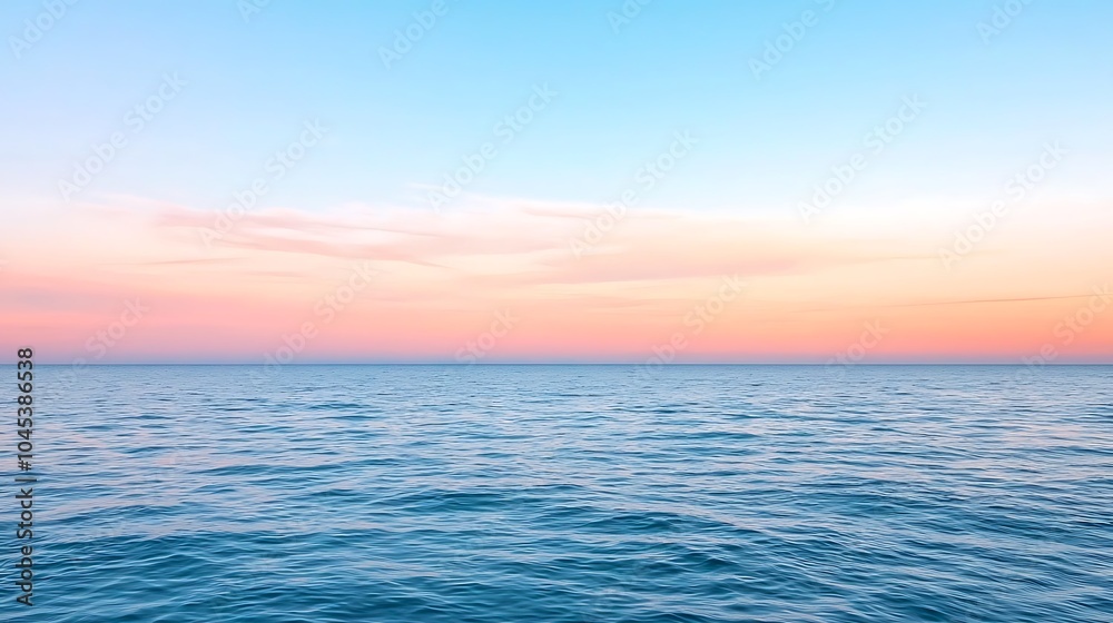 Fototapeta premium Stunning serene seascape at dawn with gentle waves and a colorful sky reflecting tranquility and beauty