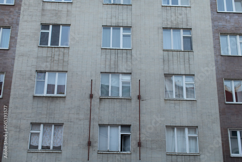 A large building that features an abundance of windows adorning its exterior is quite striking and eyecatching in appearance