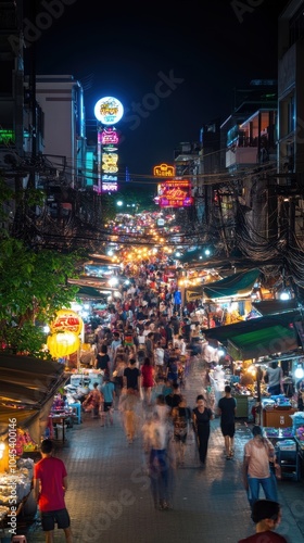 Crowd walking through busy night market in bangkok chinatown