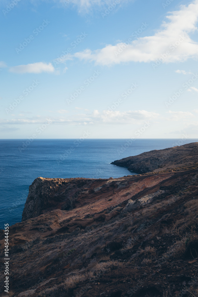 Rocky Coastline with Blue Ocean and Sky Rocky Coastline with Blue Ocean and Sky