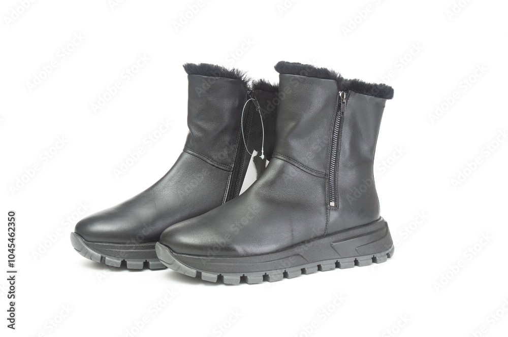 Pair of female winter boots close up on a white background Pair of female winter boots close up on a white background