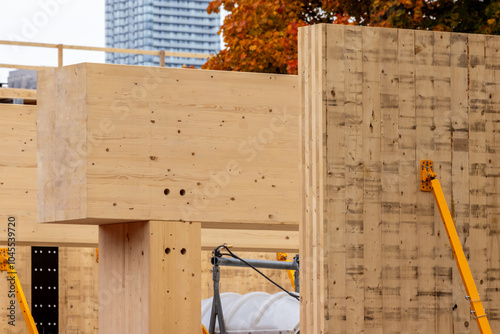 Glue laminated wall panel on mass timber beams and posts in a multi story green, sustainable, residential high rise or commercial office building construction project
