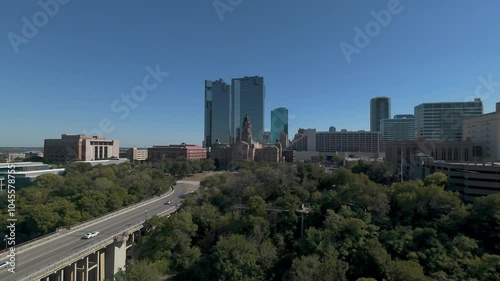 Fort Worth, TX USA - October 19, 2024: Aerial drone video of Main Street Bridge leading towards the Tarrant County Courthouse.  photo