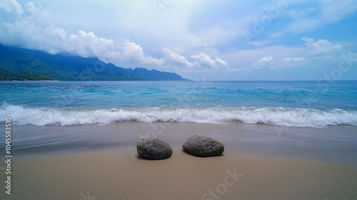 Tranquil Beach with Stones and Gentle Waves