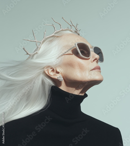 Edgy Jewelry portrait of Female senior fashion model, elderly, old woman, wearing a pearl crown headband posing for fashion magazine. her hair is silver, natural beauty, aging gracefully concept photo