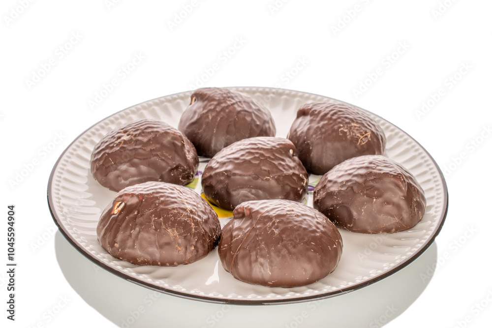 Marshmallow in chocolate on ceramic dish, macro, isolated on white background. Marshmallow in chocolate on ceramic dish, macro, isolated on white background.