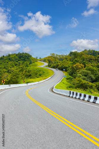 Popular view point of double s-curve road up to the hill with green tree and sky, called curve number 3 at Nan province, Northern of Thailand