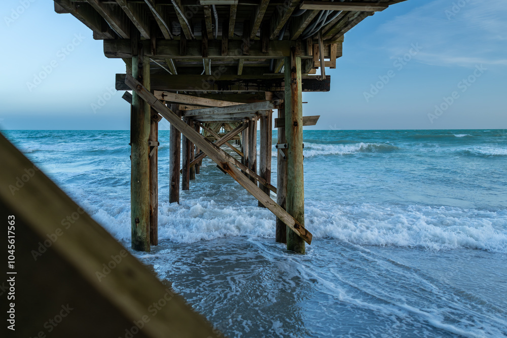 Wooden Pier Extending into Ocean Waves Wooden Pier Extending into Ocean Waves
