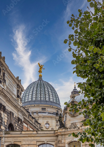 Glass Dome of Dresden Academy of Arts Featuring Golden Angel Statue Against Open Sky, Showcasing Architectural Elegance and Iconic German Landmark