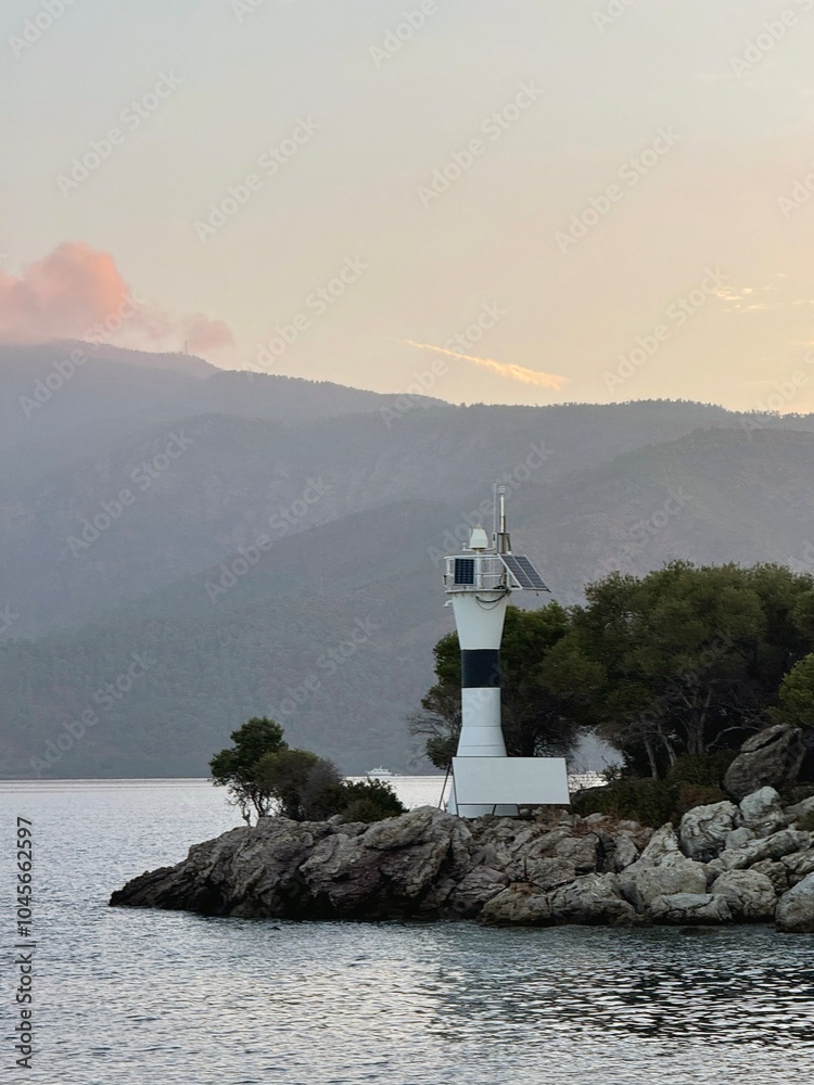 Sunrise on the island with its lighthouse in Turkey