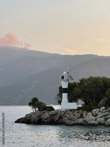 Sunrise on the island with its lighthouse in Turkey