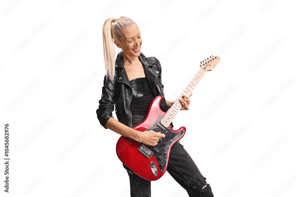 Beautiful female rock musician playing a guitar Beautiful female rock musician playing a guitar