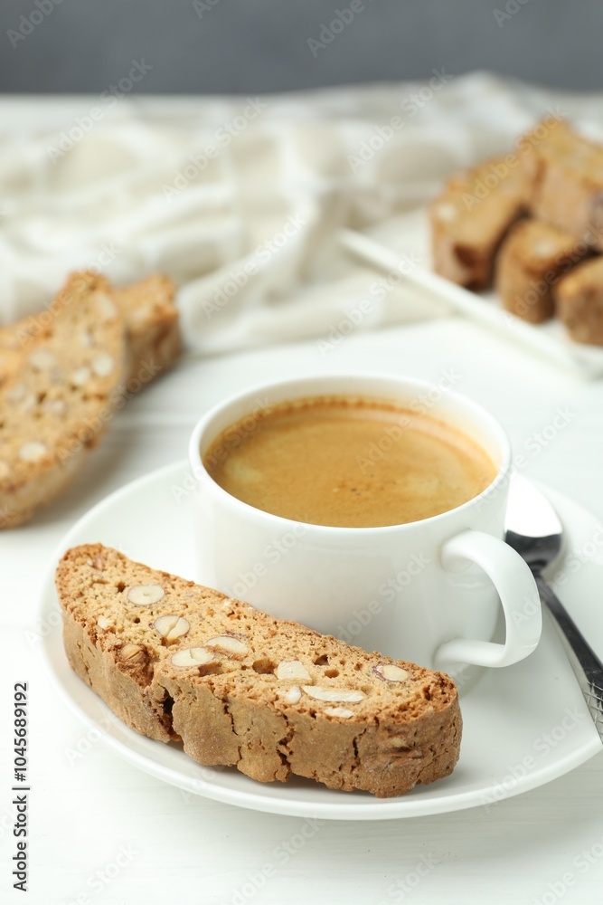 Traditional Italian almond biscuits (Cantucci) and coffee on white table, closeup Traditional Italian almond biscuits (Cantucci) and coffee on white table, closeup