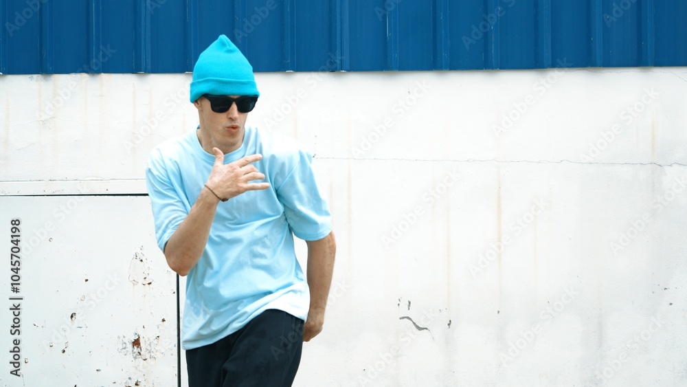 Motion shots of youthful hipster moving in lively groove at street. Caucasian break dance choreographer dancing in hip hop style. Energetic dancer perform b-boy dance. Outdoor sport 2024. Hiphop. Motion shots of youthful hipster moving in lively groove at street. Caucasian break dance choreographer dancing in hip hop style. Energetic dancer perform b-boy dance. Outdoor sport 2024. Hiphop.